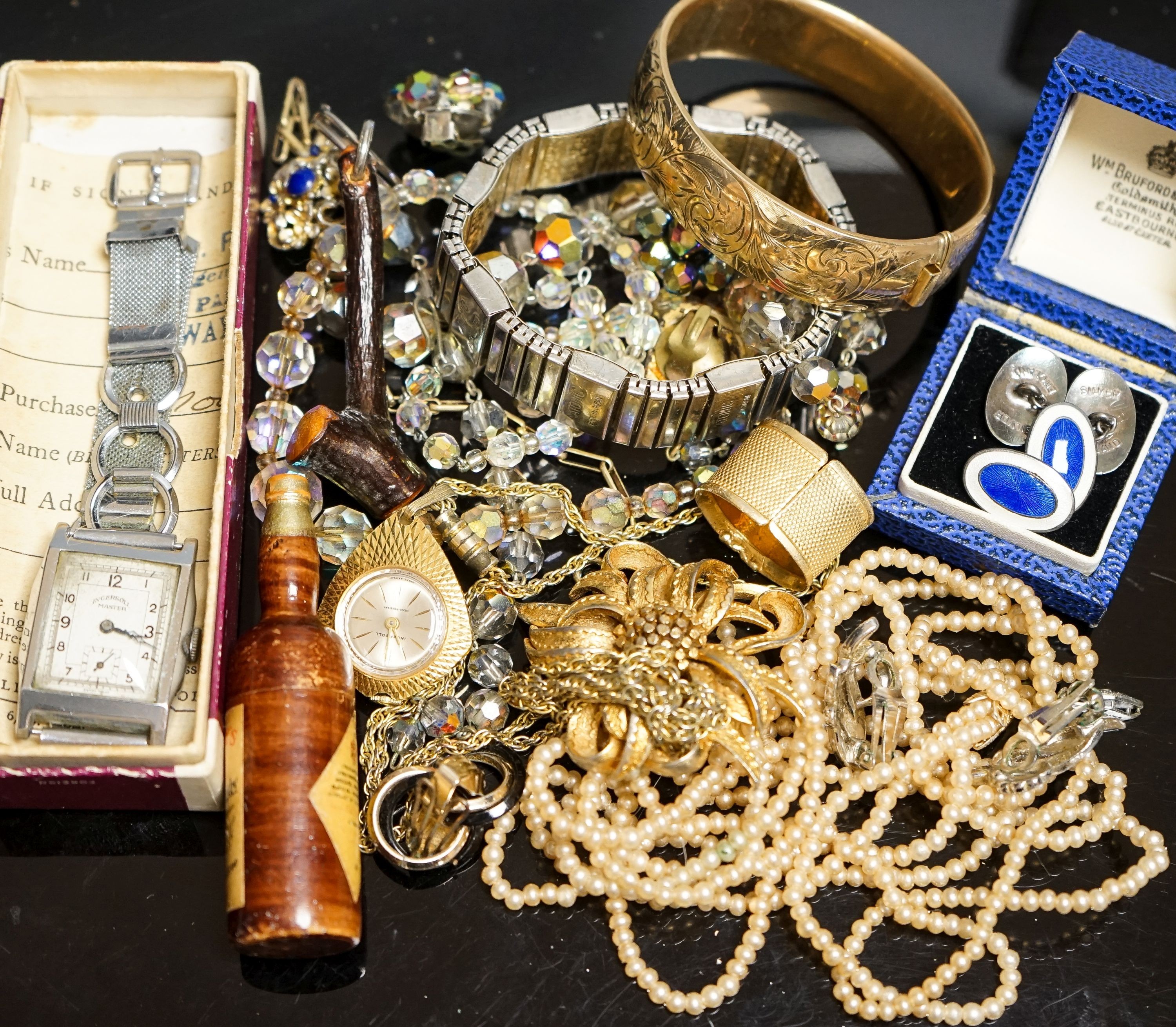 A pair of white metal and two colour enamel cufflinks and a quantity of assorted costume jewellery.